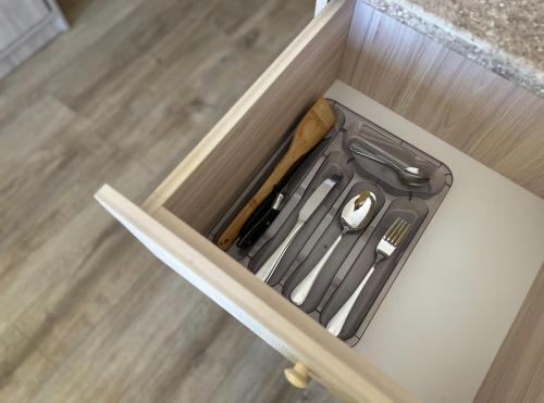 a drawer with a knife and a banana in it at Eniseli in Chakvi