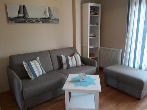 a living room with a couch and a coffee table at Koserow, Förster-Schrödter-Str 16 WE 2 in Ostseebad Koserow