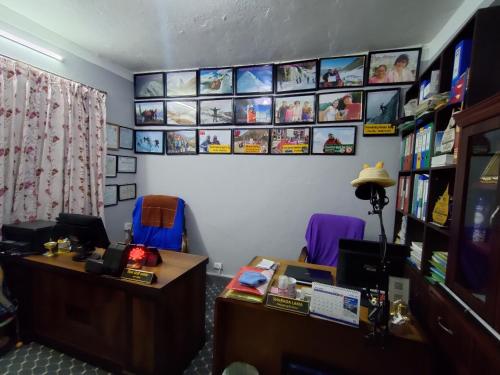 an office with two desks and two purple chairs at Friendship Home Stay in Kathmandu