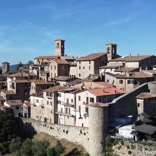 a group of buildings on top of a hill at La Bella Vista in Collazzone