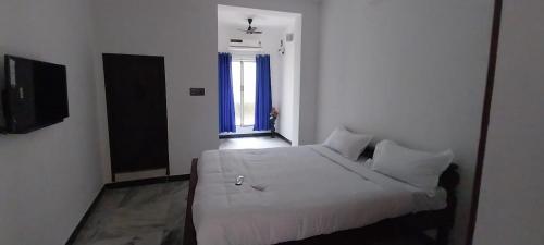 Ένα ή περισσότερα κρεβάτια σε δωμάτιο στο 4BHK-Duplex