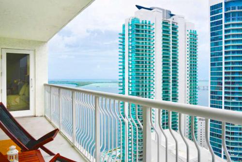 a balcony with chairs and a view of tall buildings at LUXURY 2 Bedroom Apartment At BRICKELL with pool in Miami
