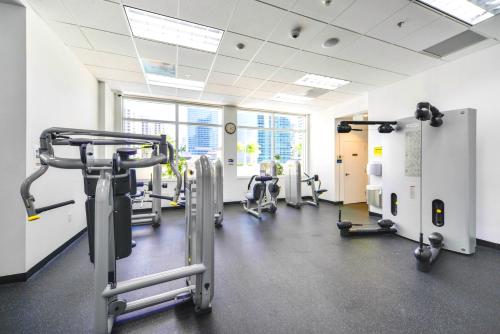 a gym with treadmills and machines in a room at LUXURY 2 Bedroom Apartment At BRICKELL with pool in Miami