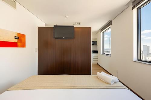 Postel nebo postele na pokoji v ubytování Hospedez - Flats New Osasco Trade Center