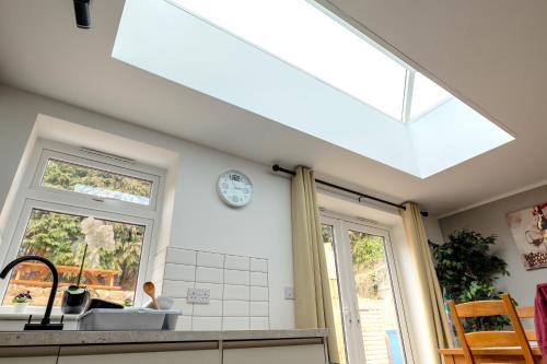 a kitchen with a large skylight in the ceiling at Peakstone House in Sheffield