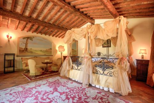 Ένα ή περισσότερα κρεβάτια σε δωμάτιο στο Relais Villa Baldelli