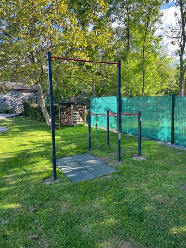a batting cage in a park with grass at Domek Prosetin244 in Prosetín