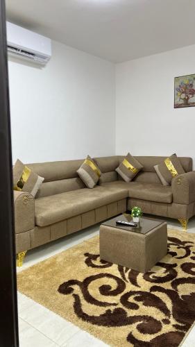 a living room with a couch and a coffee table at Blue Bird House in Wadi Musa