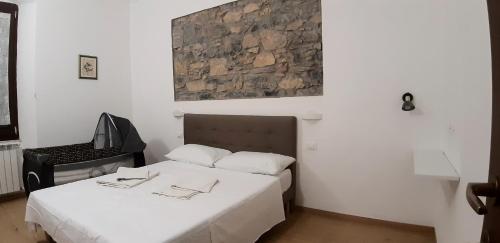 Posteľ alebo postele v izbe v ubytovaní Chez Sabrine - La Spezia Via Fiume 112