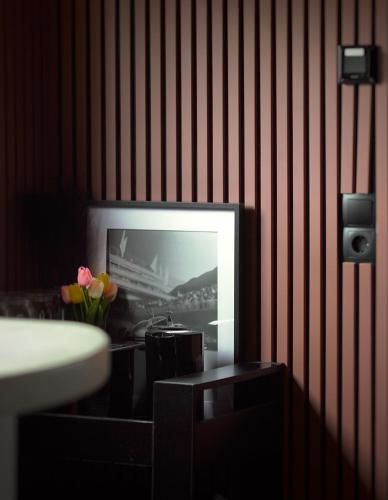 a television on a wall with a picture on it at Houseboat-Amsterdam-Classic in Amsterdam