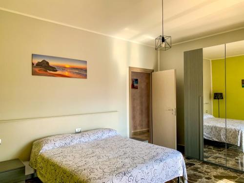 a bedroom with a bed and a mirror at Labanca's Suite in Campobasso