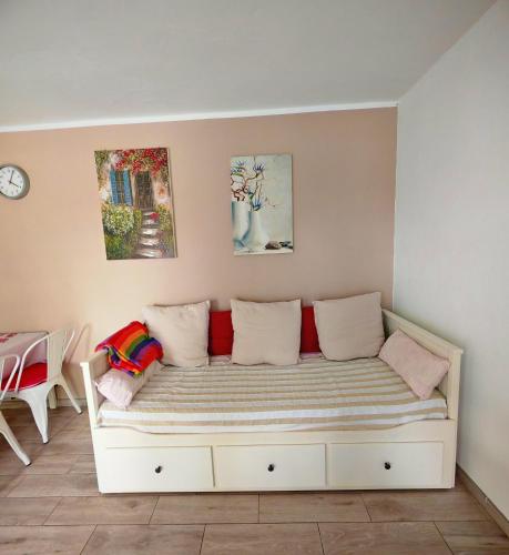 a room with a couch with pillows on it at La casa di marcos in Costa Calma