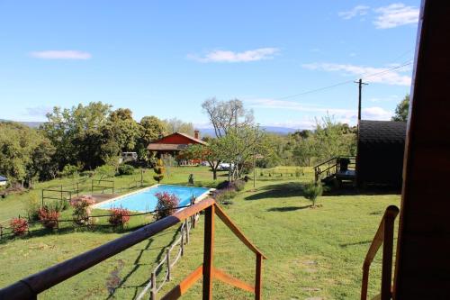 a view of a yard with a swimming pool at Quinta Da Devesa B1 in Vinhais
