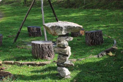 a rock tower in the middle of a field at Quinta Da Devesa B1 in Vinhais