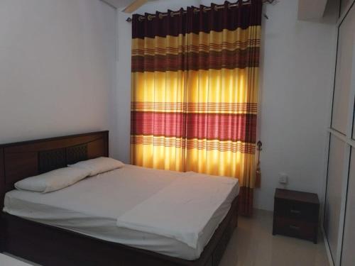 Postel nebo postele na pokoji v ubytování Huluganga Ella Resort-Geesh Residence