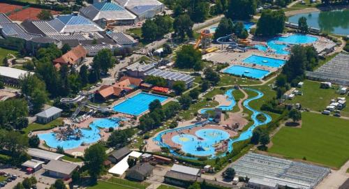 an aerial view of a resort with several pools at Spa Cottage the Moon house Terme Čatež in Čatež ob Savi