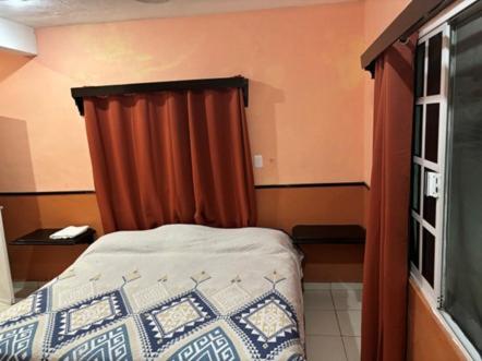 Hotel Posada Los Tulipanesにあるベッド