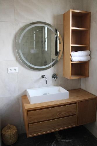 a bathroom with a sink and a mirror at Villa Bakhta in Najem