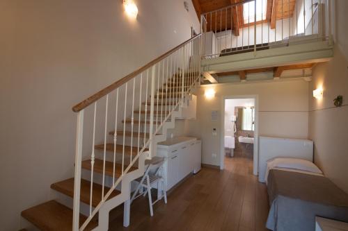 a room with a staircase and a bedroom at Agriturismo B&B Vista Parco in Savio di Ravenna