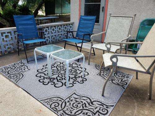 a group of chairs and a table on a patio at Villa 101, Scenic river view from patio in Glen Rose