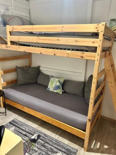a bunk bed in a room with a bunk bed frame at Deine Pension, Double Room P1, 1-2 beds, 10qm, Check-in 4PM - 5AM in Creglingen