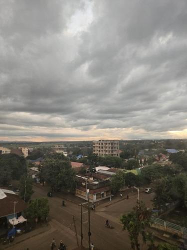 a view of a city with a cloudy sky at Tulivu Urban - Twiga Hotel in Moshi