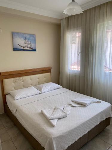 Postel nebo postele na pokoji v ubytování Dalyan Vira Hotel