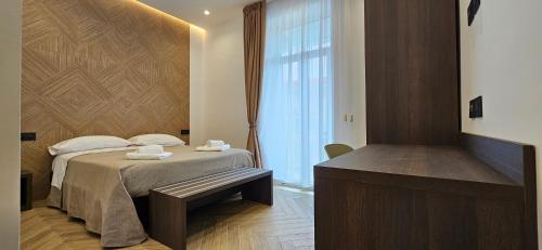 Postel nebo postele na pokoji v ubytování Hotel Zara Napoli