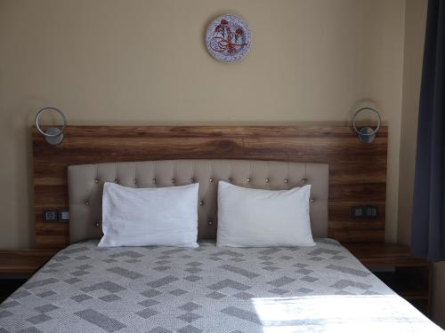 Ένα ή περισσότερα κρεβάτια σε δωμάτιο στο Sevin Stone Hotel