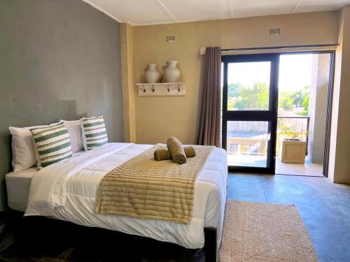 Ένα ή περισσότερα κρεβάτια σε δωμάτιο στο Gwango Tamarillo Estate