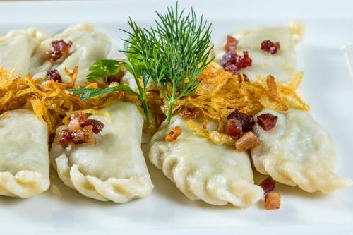 a group of dumplings on a white plate at Hotel Logos in Zakopane