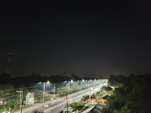 a city street with street lights at night at BLVD1Rec in Paraíso