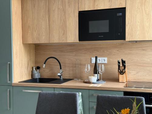 Η κουζίνα ή μικρή κουζίνα στο Topinambur Apartmány