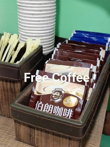 a box of free coffee and a container of chocolateuts at Baoshan Hotel in Zhongli
