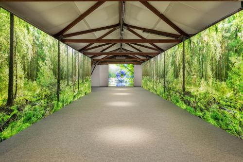 a tunnel with trees and a walkway at Crowne Plaza Milan Linate by IHG in San Donato Milanese