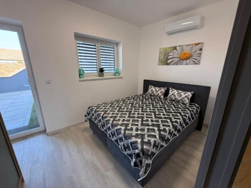 Ένα ή περισσότερα κρεβάτια σε δωμάτιο στο Topinambur Apartmány