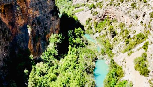 an aerial view of a river in a canyon at Ignis Rural Apartment - Casillas Valle de Ayora in Jalance