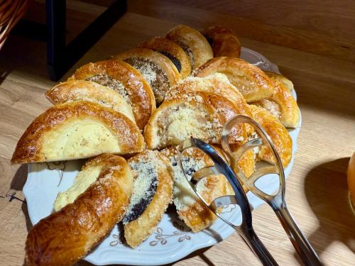 a plate with a bunch of bread on a table at Pension U Studny in Harrachov