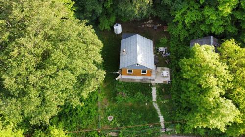 an overhead view of a house in the middle of a forest at Cottage in Tskhvarichamia forest in Mtskheta