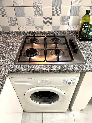 a stove top oven sitting on top of a counter at Cozy Apartment Near Oldtown Antalya in Antalya