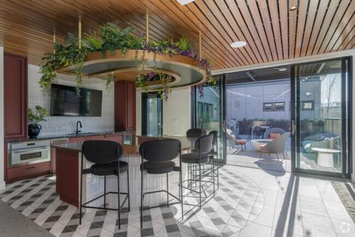 a kitchen with a island with bar stools at Luxury 1BEDROOM 1BATH SLABTOWN-PEARL in Portland