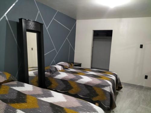 Ένα ή περισσότερα κρεβάτια σε δωμάτιο στο Departamento Esperanza 1