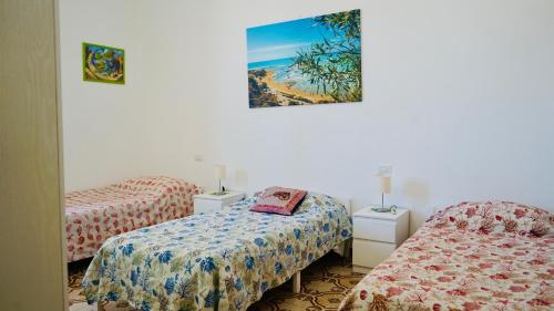 Posteľ alebo postele v izbe v ubytovaní Sole Mare - Casa Vacanze Chiavarello