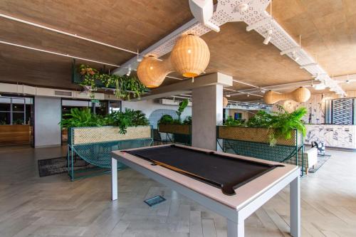 a pool table in the middle of a room at Amazing Views in the WEX in Cape Town