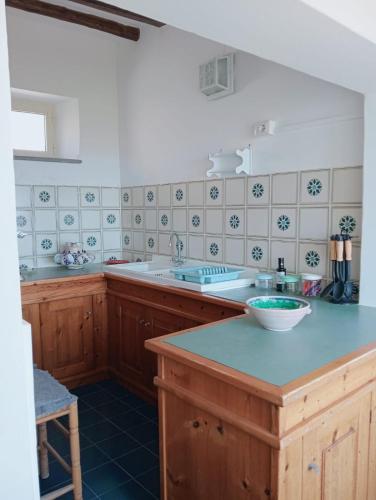 a kitchen with a sink and a counter top at Villa MariaRosa in Lipari