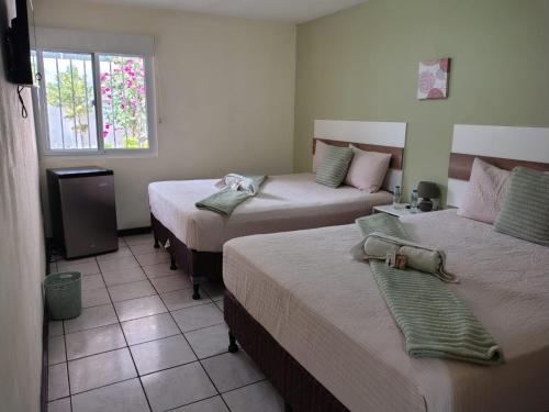 Postel nebo postele na pokoji v ubytování Hotel Urban Home