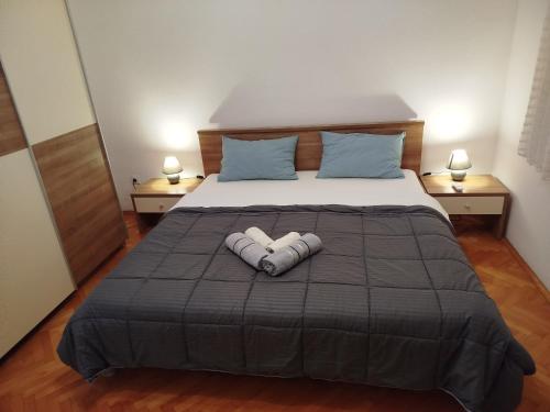 a bed with two pillows on top of it at Noel in Seline