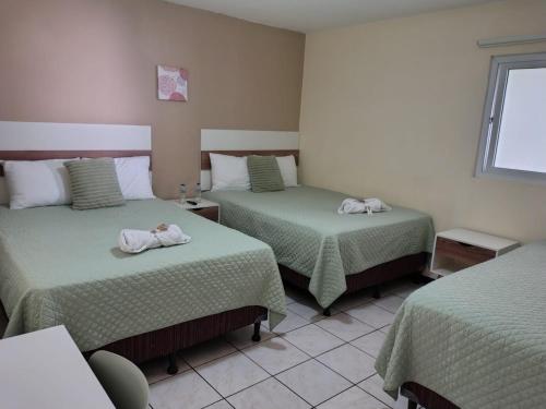 Postel nebo postele na pokoji v ubytování Hotel Urban Home
