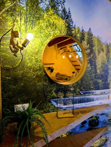 a room with a teddy bear and a mirror at Les Spas de la mer, Appart&Spa Canopée, 100m de la plage, Love Room in Le Grau-du-Roi