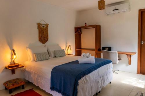Katil atau katil-katil dalam bilik di Aloha Algodões Guest House